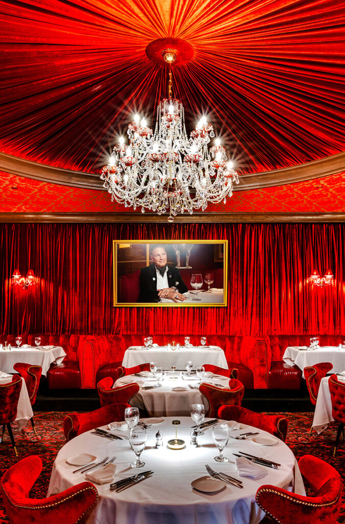 beautiful chandelier hanging over red dining room