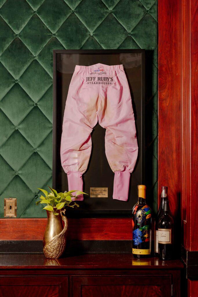 pink jockey pants framed on wall